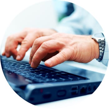 Closeup of typing male hands Laptop Causes TOS Pain