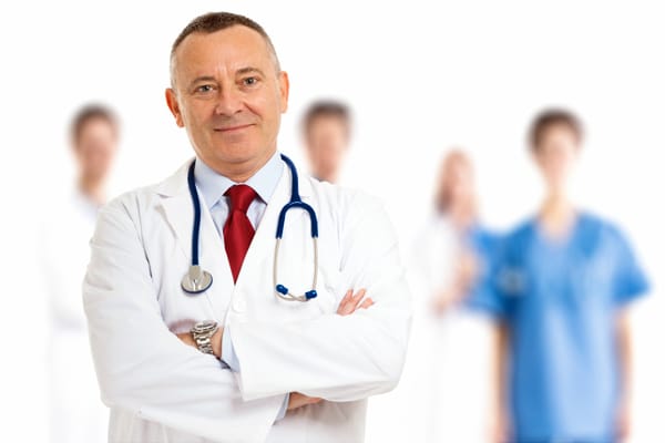 Male Doctor Crossed Arms Medical Team Cropped Diagnosis of venous TOS