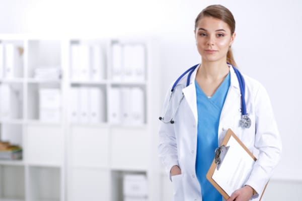 Female Doctor Scrubs Clipboard-Cropped Blue Imaging Diagnosis of Arterial TOS