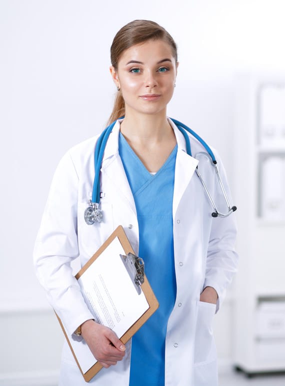 Female Doctor Scrubs Clipboard Blue Treatment Panel-Cropped Mobile Female blue-eyed surgeon holding clipboard smiling slightly can treat thoracic outlet syndrome